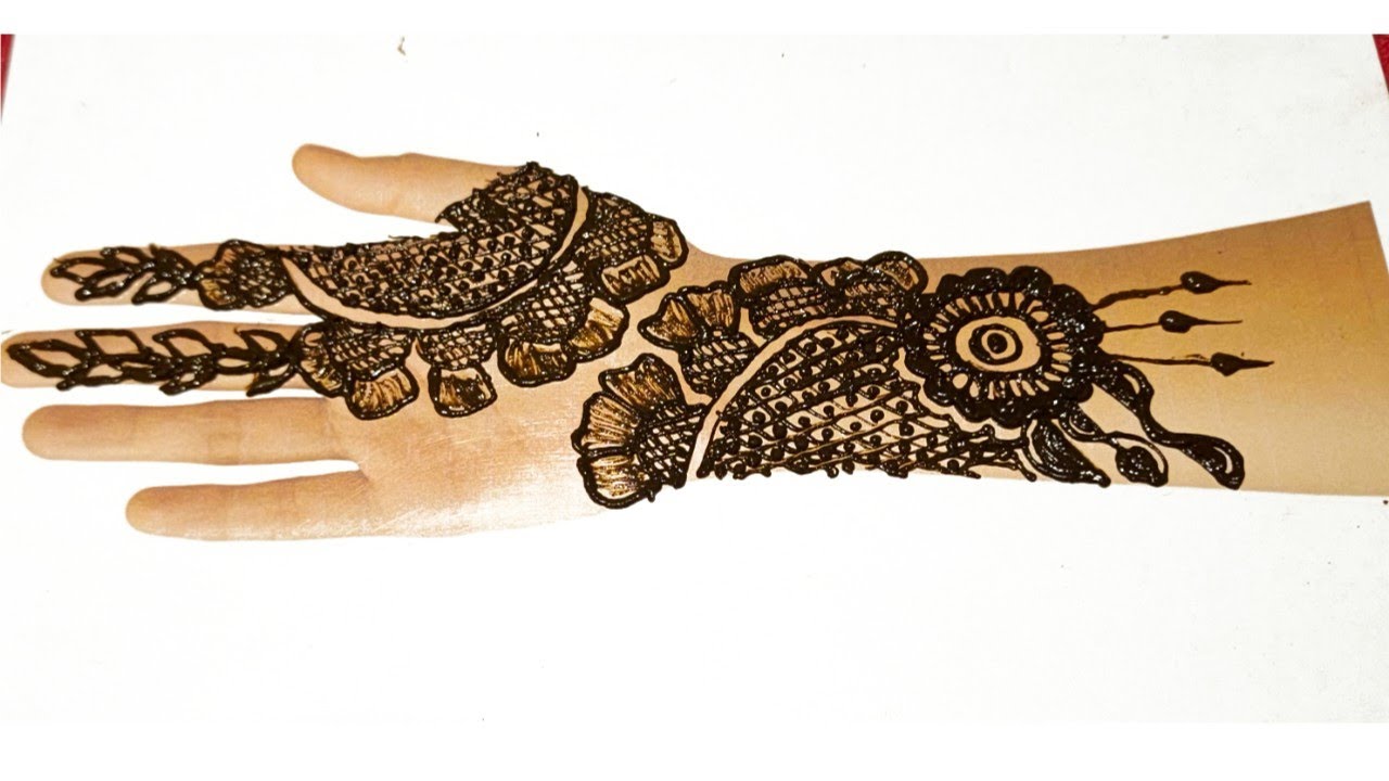 Elegant Arabic Style Back Hand Mehndi Design with Floral and Leaf Motifs. 