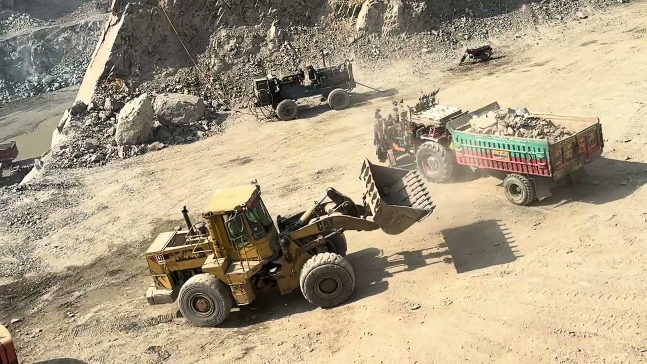 Trucks | Heavy Equipment ActionGiant Caterpillar Machine Loading Huge SCaterpillar Loading Big Rocks