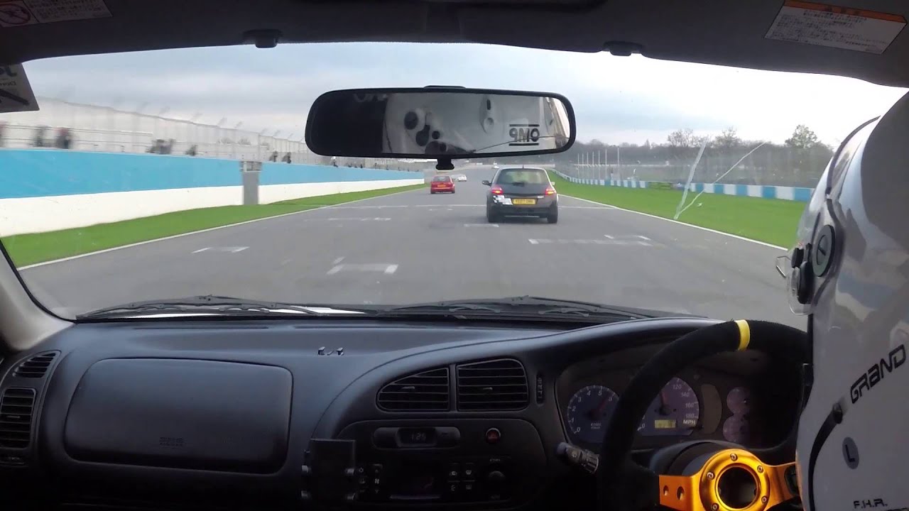 Mitsubishi Evo VI chasing Evo VII Donnington park circuit