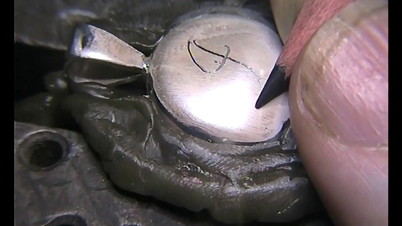 Hand Engraving a Script J on a Platinum Pendant.