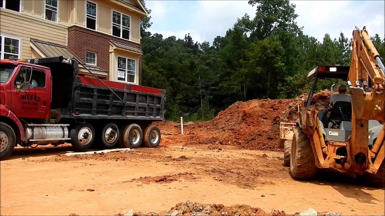 Case 580L Backhoe Loading Quad