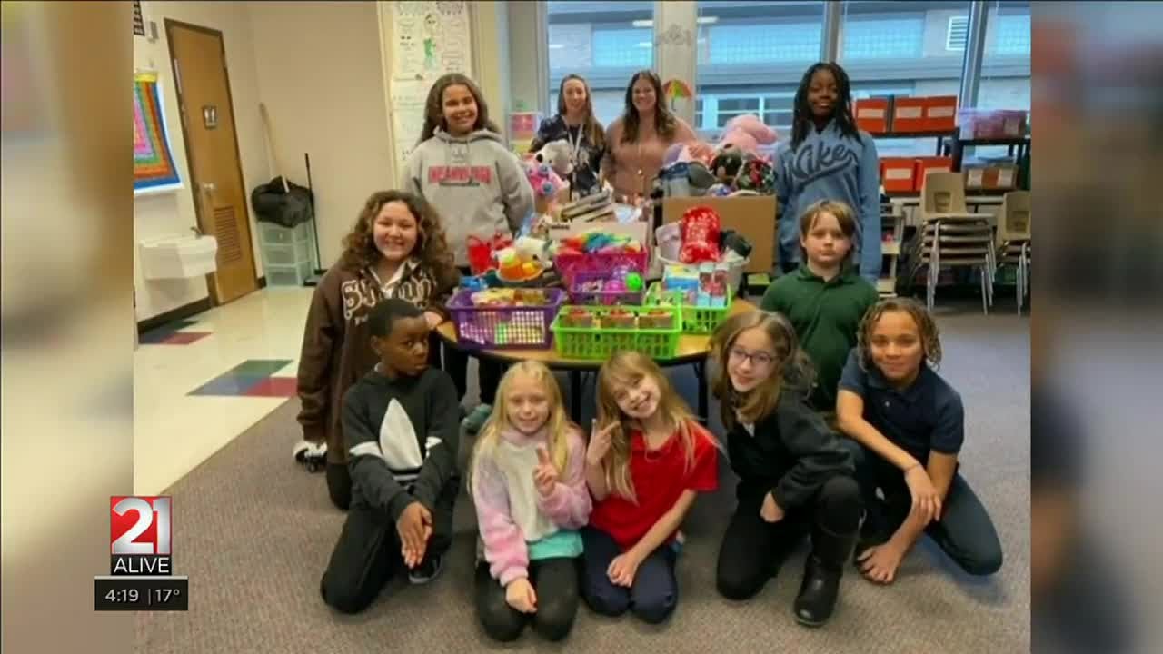 Elementary school students collect donations for kids in need