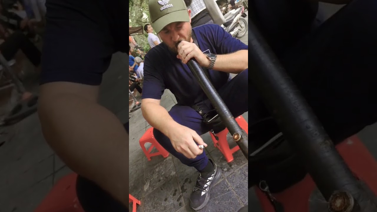 Foreigner Smoking Thuoc Lao in Hanoi Vietnam without coughing!
