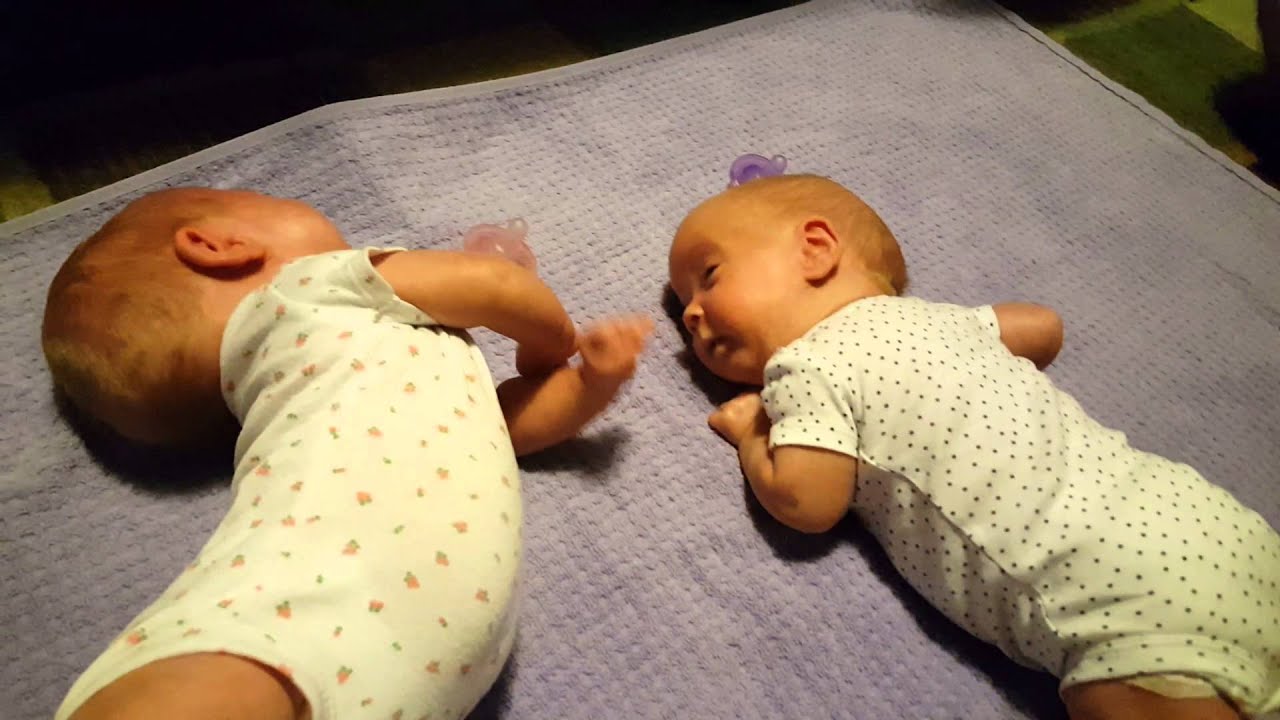 Twins attempting to roll over