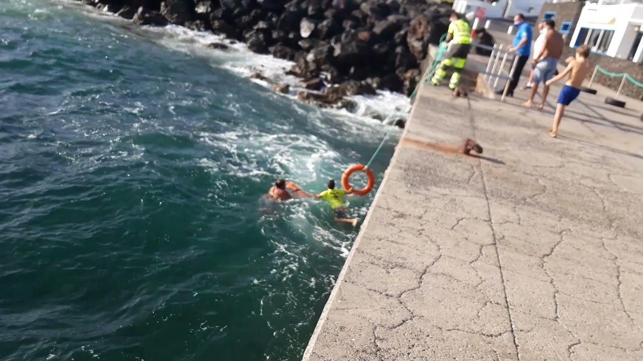 Woman rescued in rough seas at Playa Chica, Puerto del Carmen, Lanzarote
