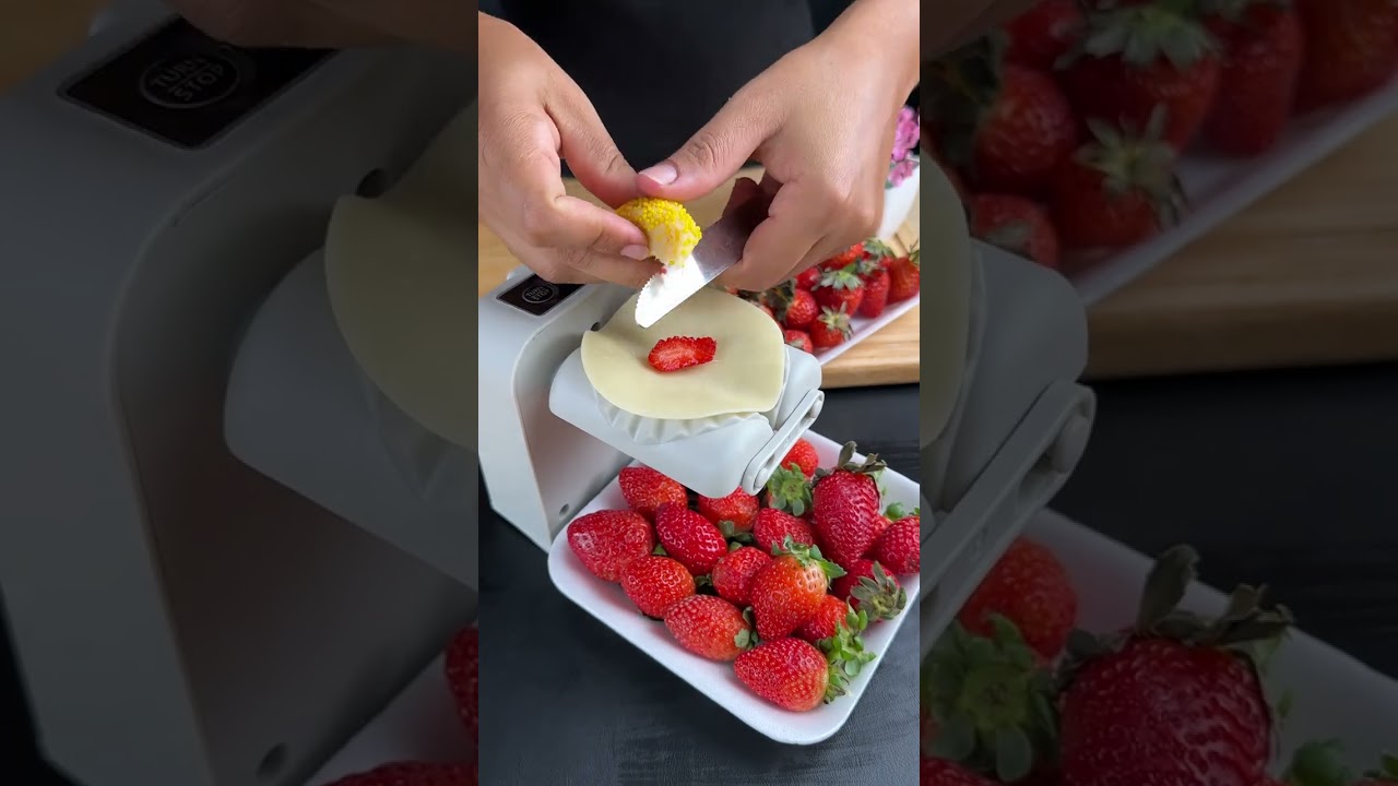 Yellow brigadeiro pastry with strawberries.