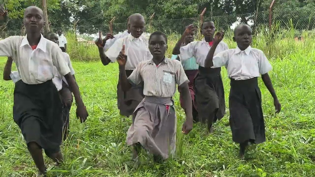Ugandan school girls teach visitors about climate change