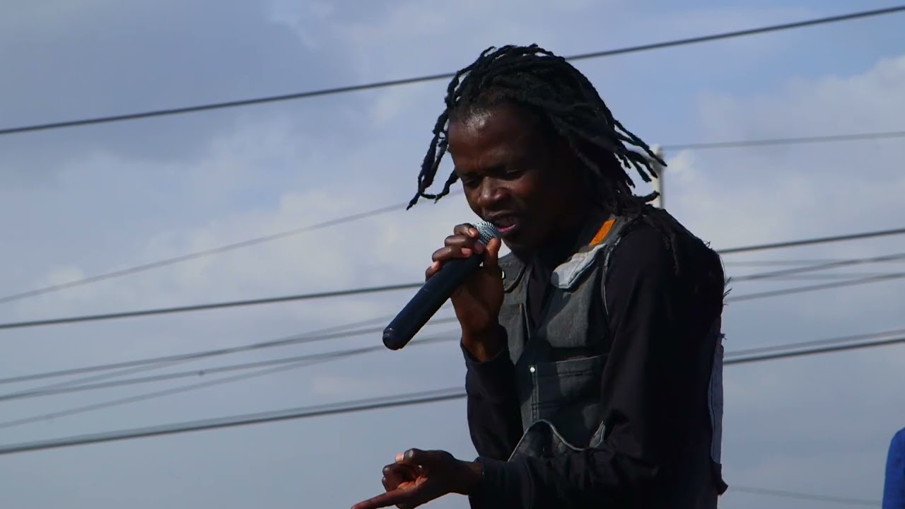 Juliani Performing one of his biggest songs in the middle of one of Africa's biggest Dumpsite.