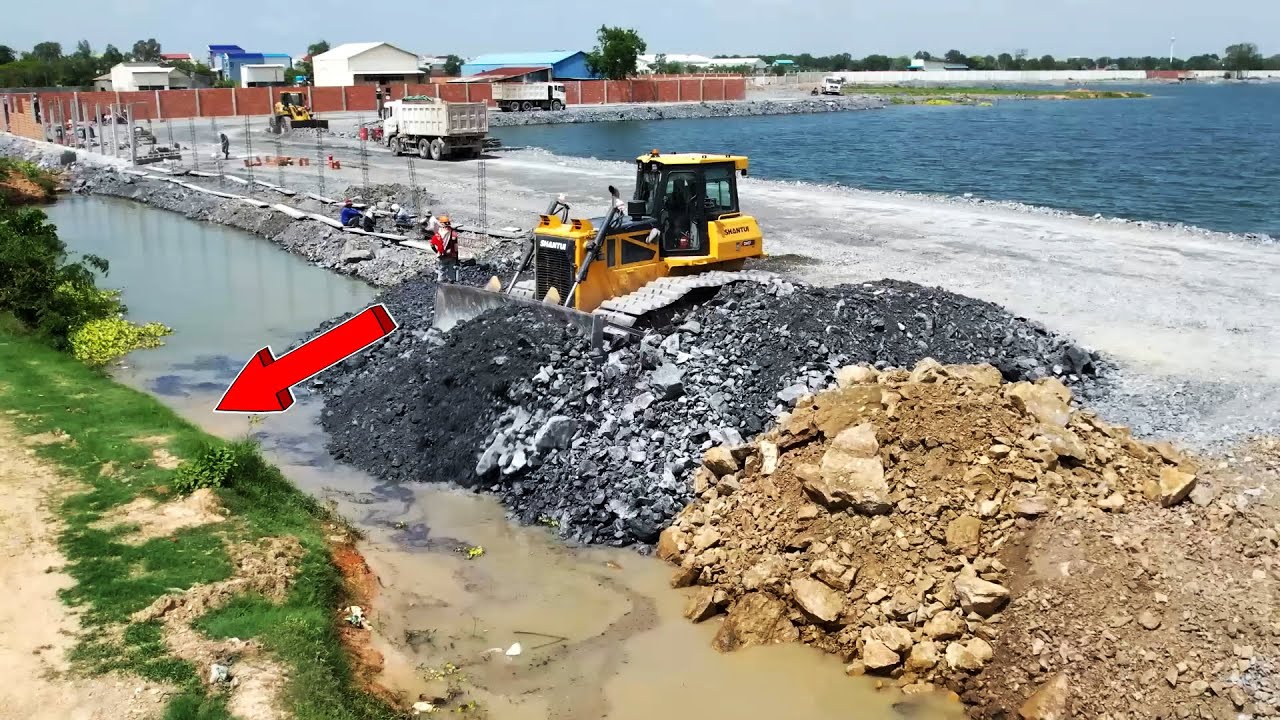 Good Dozer Pushing Stones Connected to Public Road Use Stones Filling on Canal Protect the Fence