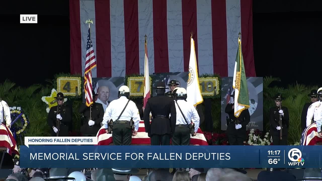 American flag-draped caskets brought in to memorial service for Palm Beach County deputies