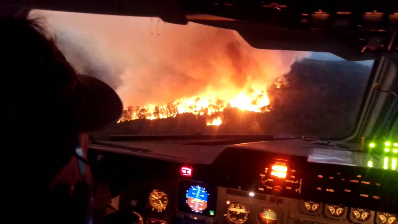 Aerial firefighting drop at dusk