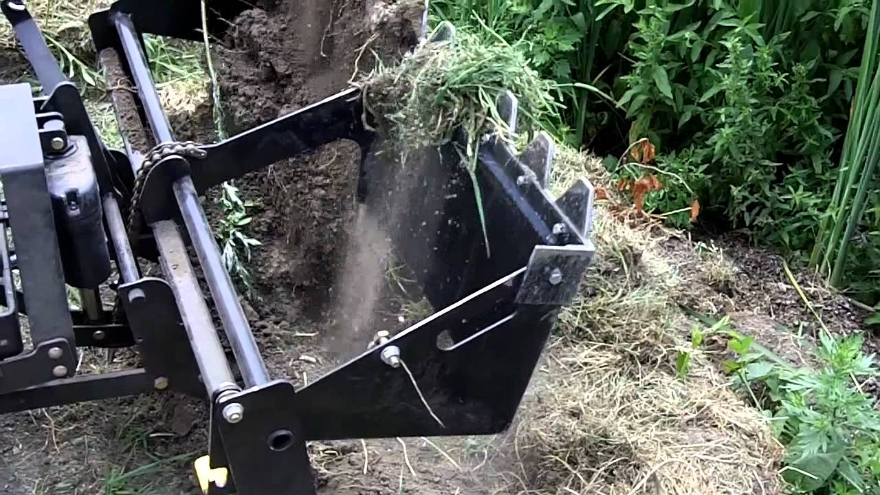 John Deere X300 & 40 inch Tractor Shovel Close up Works