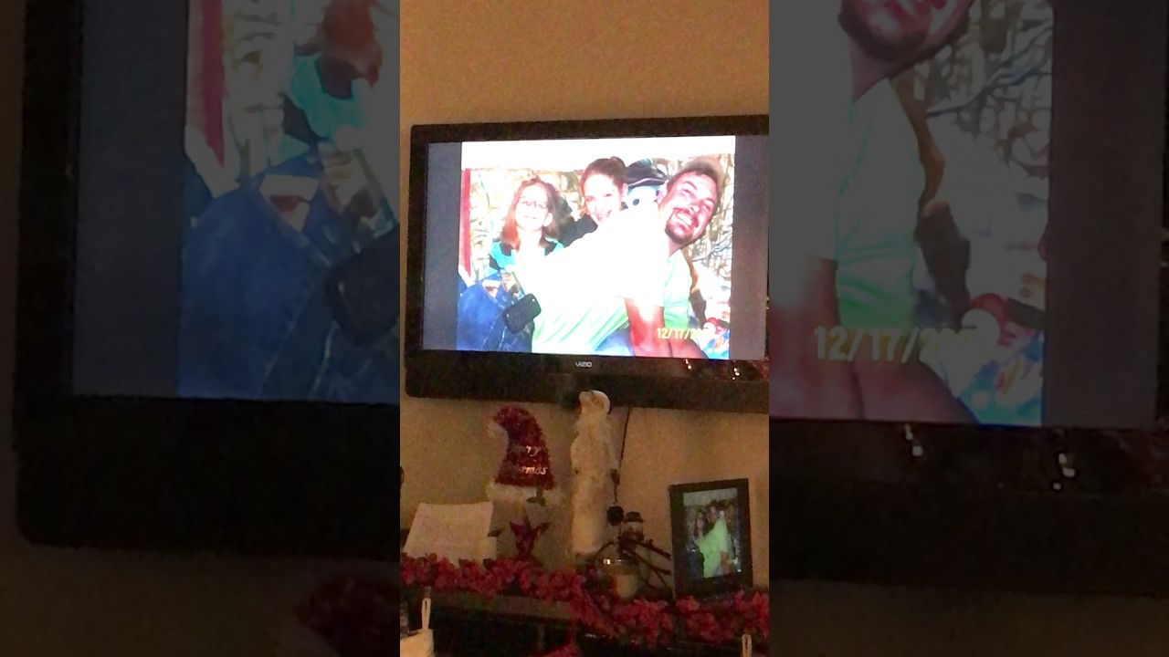The girls giving Scott the adoption papers