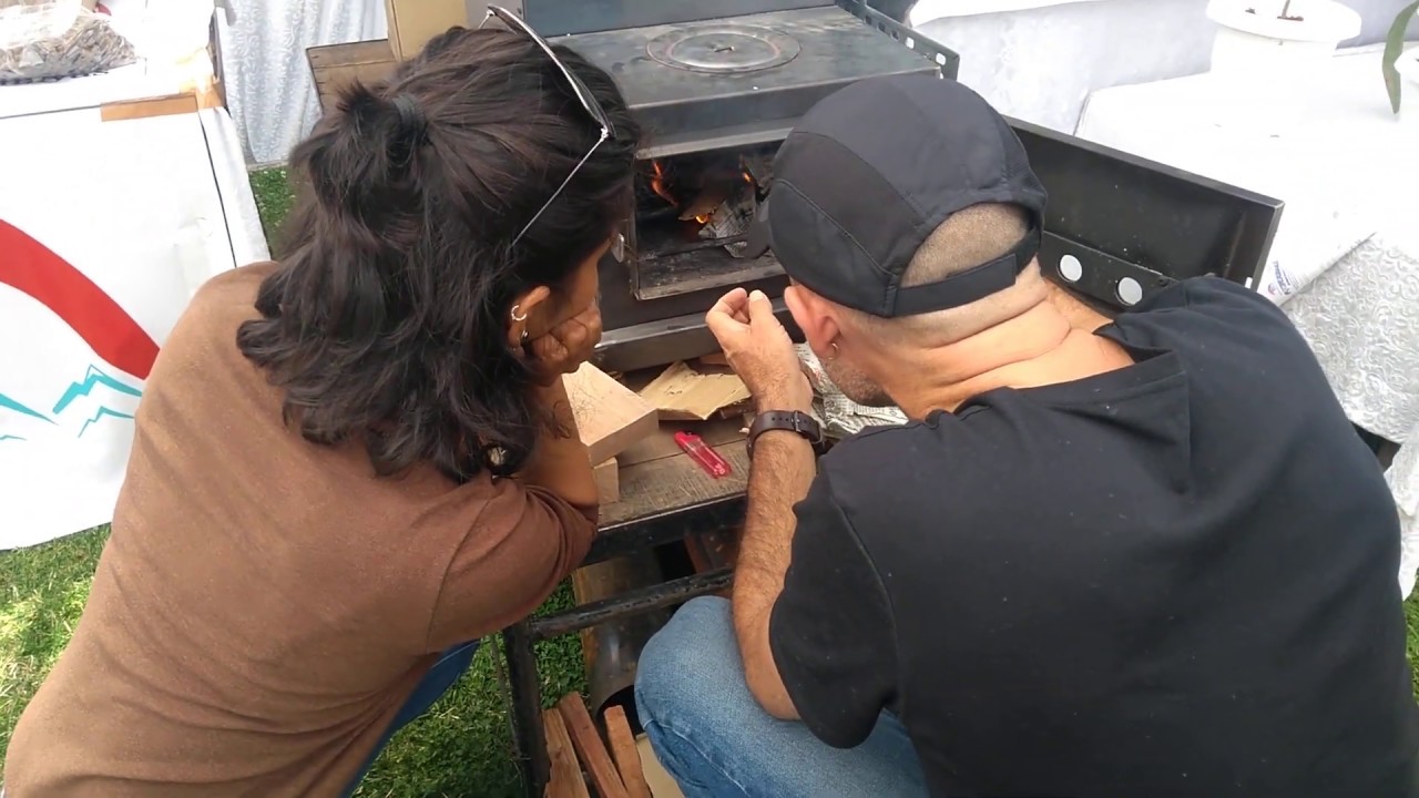 Ignition of Himalayan rocket stove at Exhibition, Peterhoff.