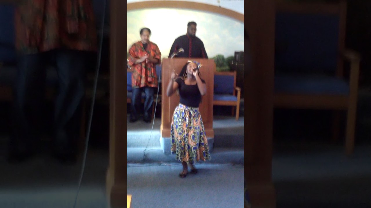 Amber Hicks praising god at refuge West park black history program