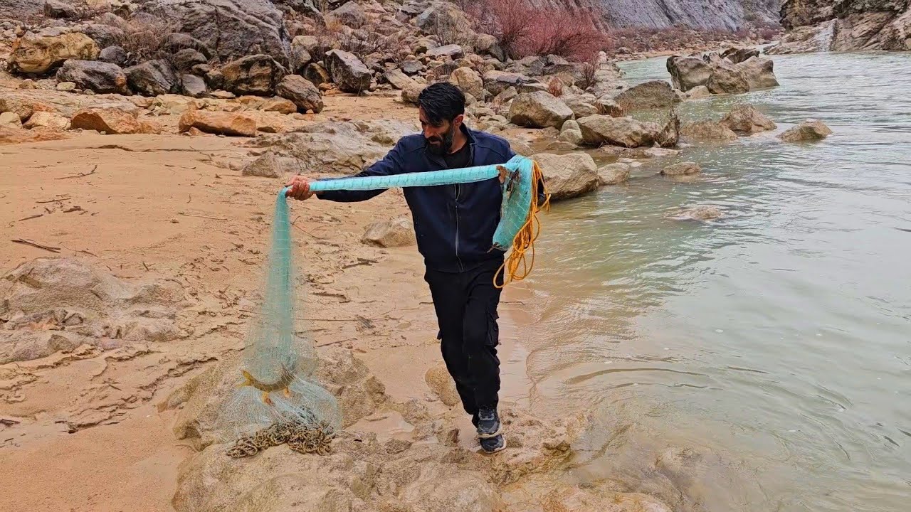 With empty hands by the river! How did Omid catch two fish? 😱🐟