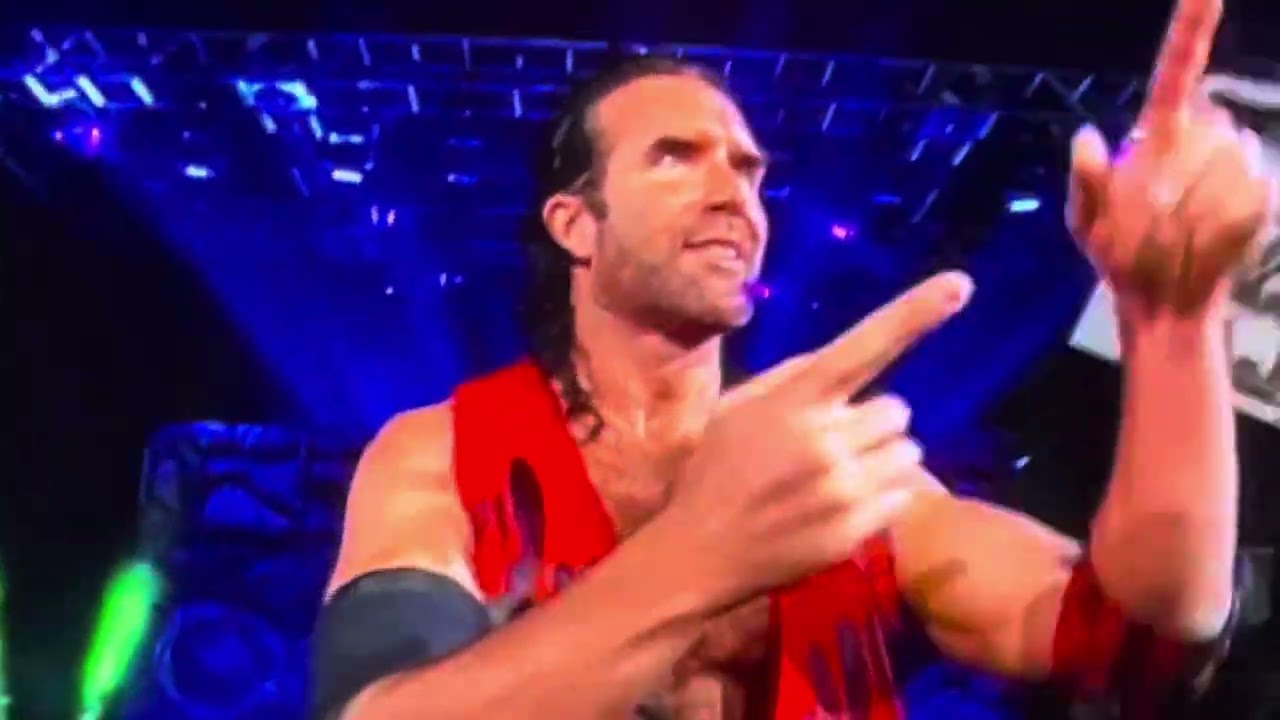 Scott Hall Informs a Fan his Sign is Upside Down I think it’s the Yellow One but they Don’t Show It