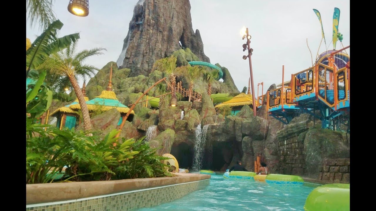 Full Lazy River Volcano Bay Tunnel POV Water Park Orlando Florida cavern cave pool lights