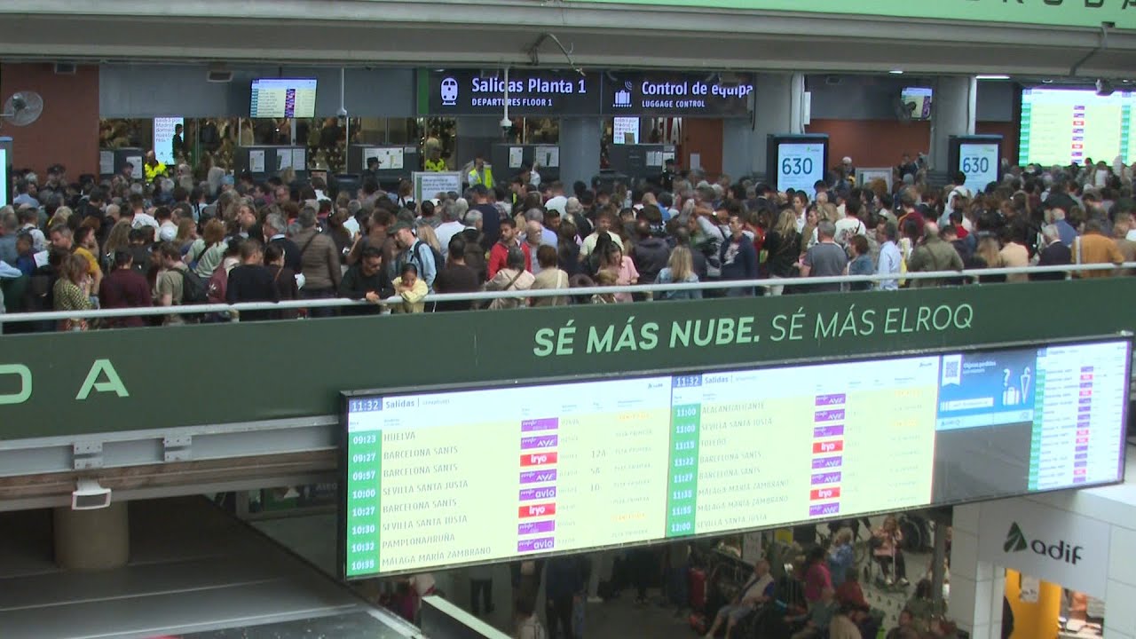 Passengers wait for trains at Madrid station, day after massive blackout | AFP