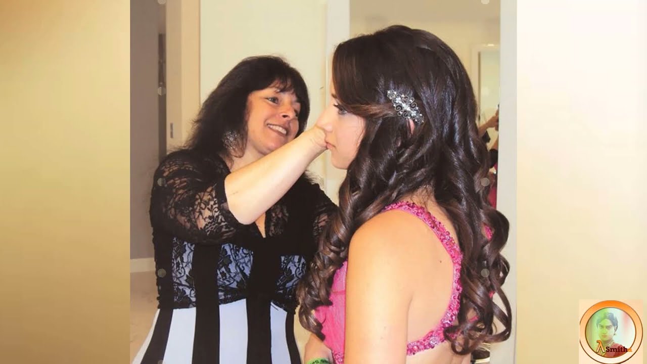 Mother prepares her cross-dressing son for events.