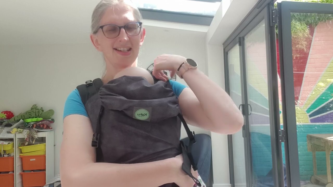 How to put on a baby carrier without putting your baby down first.