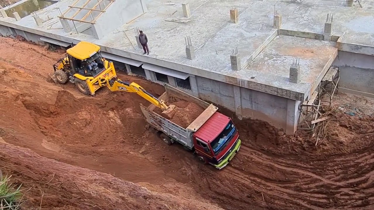 jcb loading soil in a dump truck