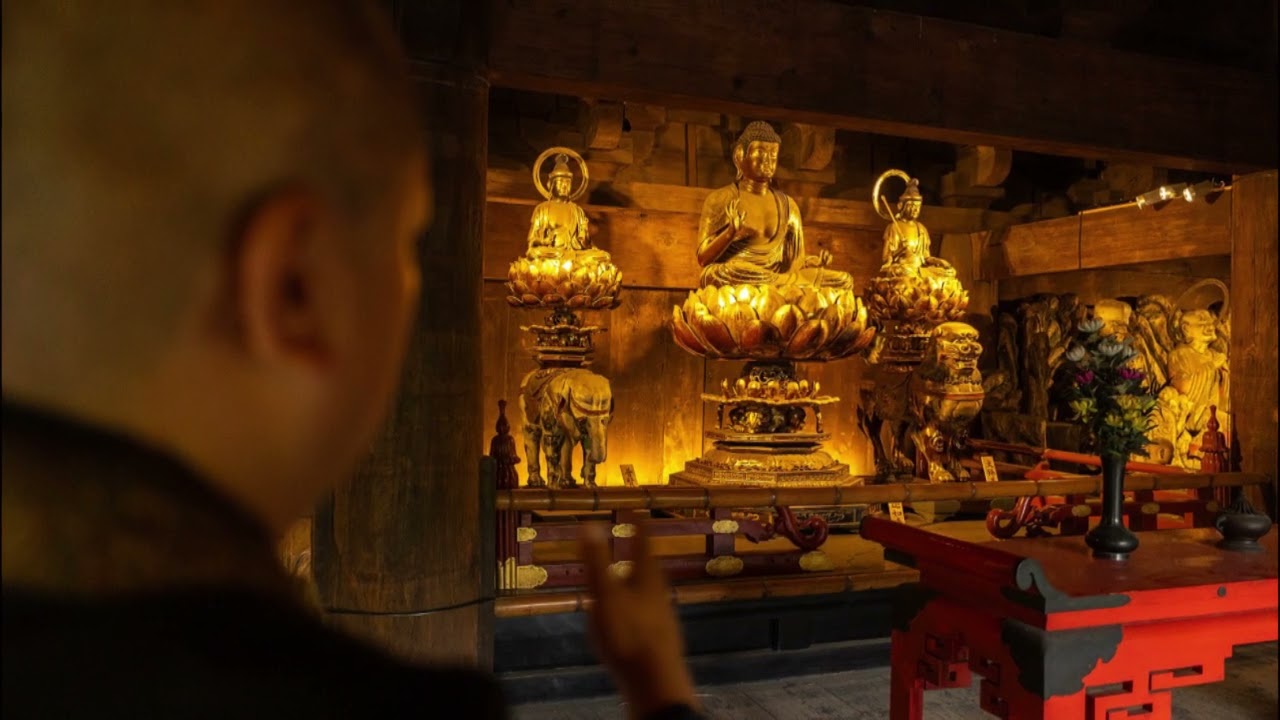 Chanting inside Zojo-ji Temple, Tokyo, Japan