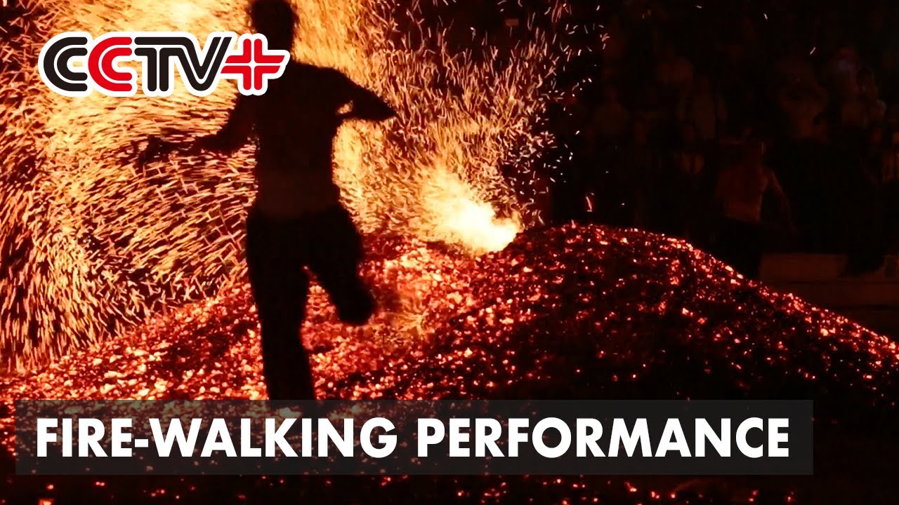 Chinese Villagers Celebrate Dragon Boat Festival with Fire Walking Performance