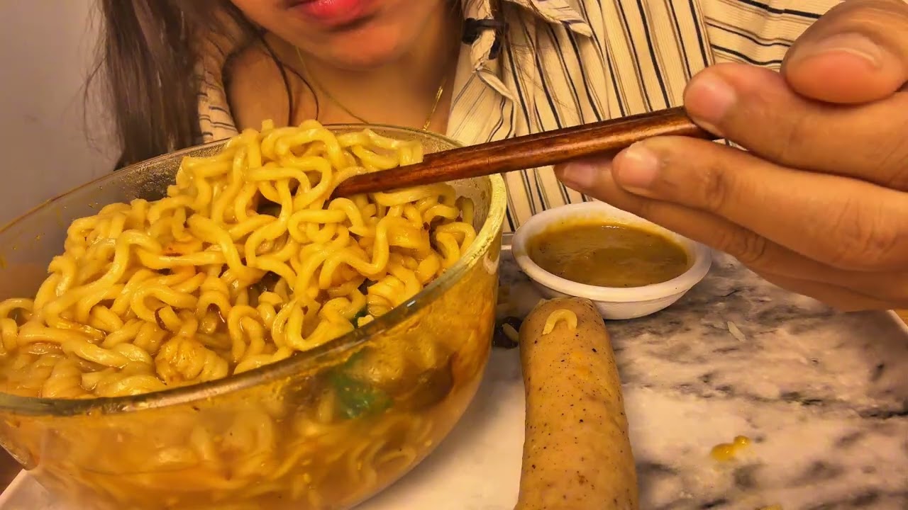 SPICY NOODLE HOTPOT/ SAUSAGE AND VEG MOMO