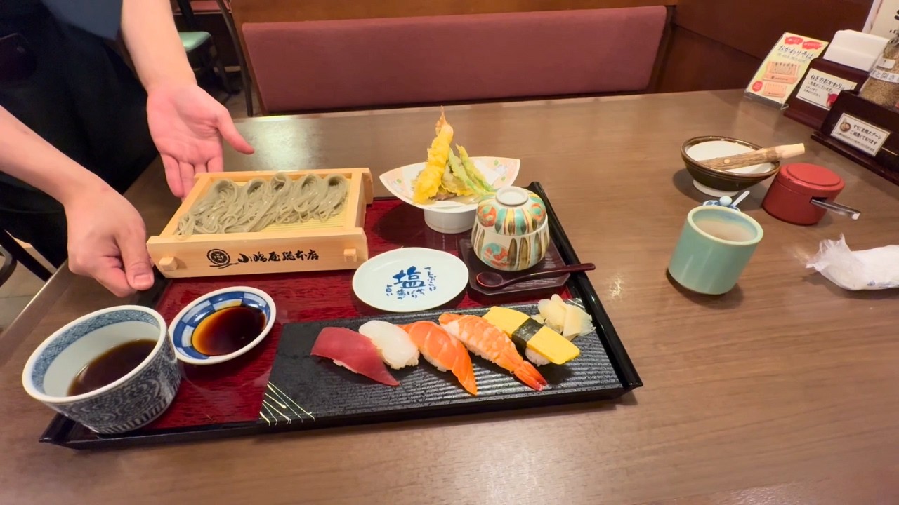 A Japanese nurse eating soba and sushi for dinner before her night shift