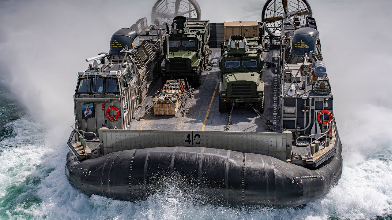 LCAC prepare to enter the well deck of the amphibious assault ship USS Wasp