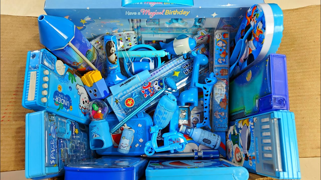 fancy blue stationery items, doraemon pencil box, pencil sharpener, notebook, geometry box, eraser