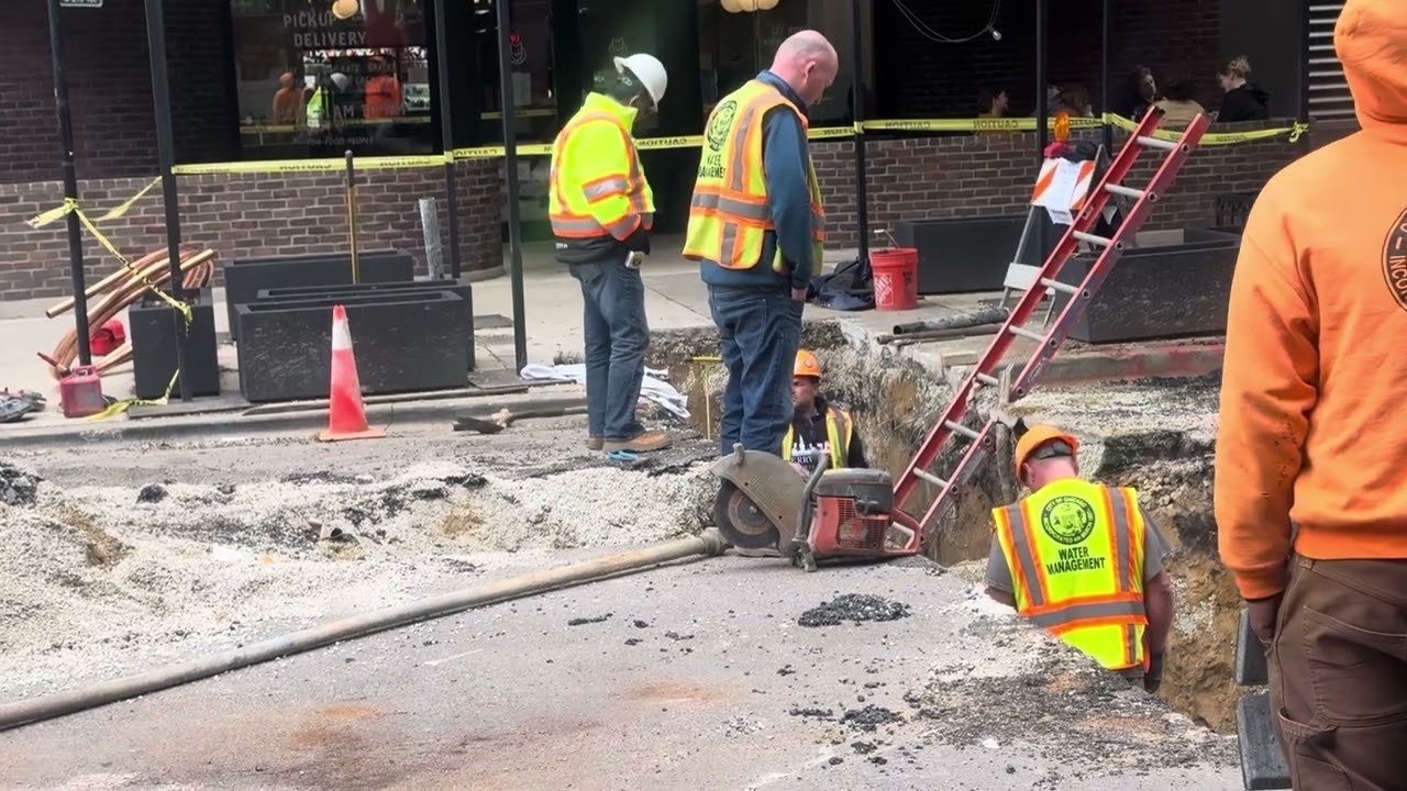 Chicago Water Department Working In Hole In The Street