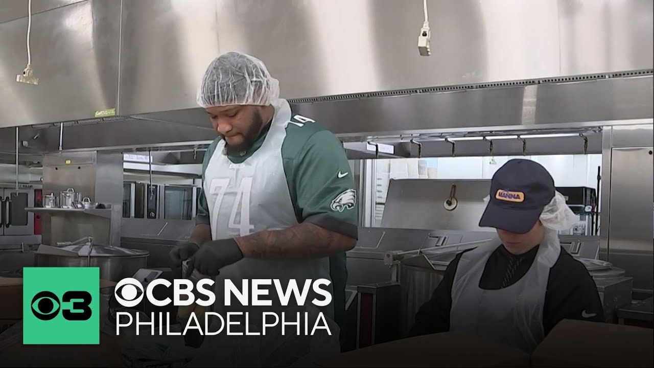 Eagles players pack meals for those in need before playoffs