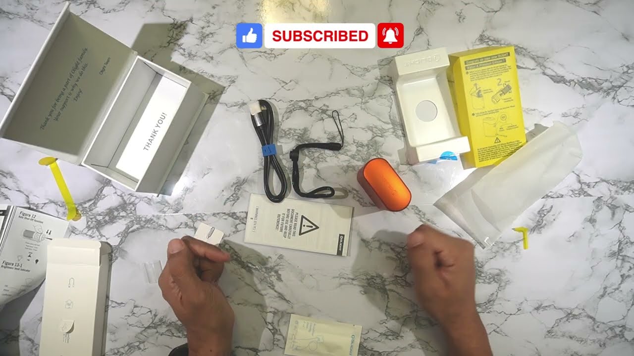 Olight Baton 4 Premium with orange charging case