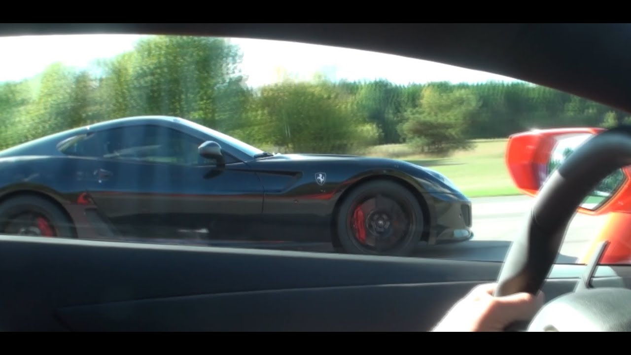 Ferrari 599 GTO vs Lamborghini LP700-4 Aventador x 2 races camerangle from the Lamborghini
