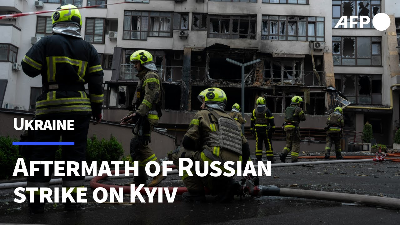 Firefighters clear rubble after overnight Russian strike on Kyiv | AFP
