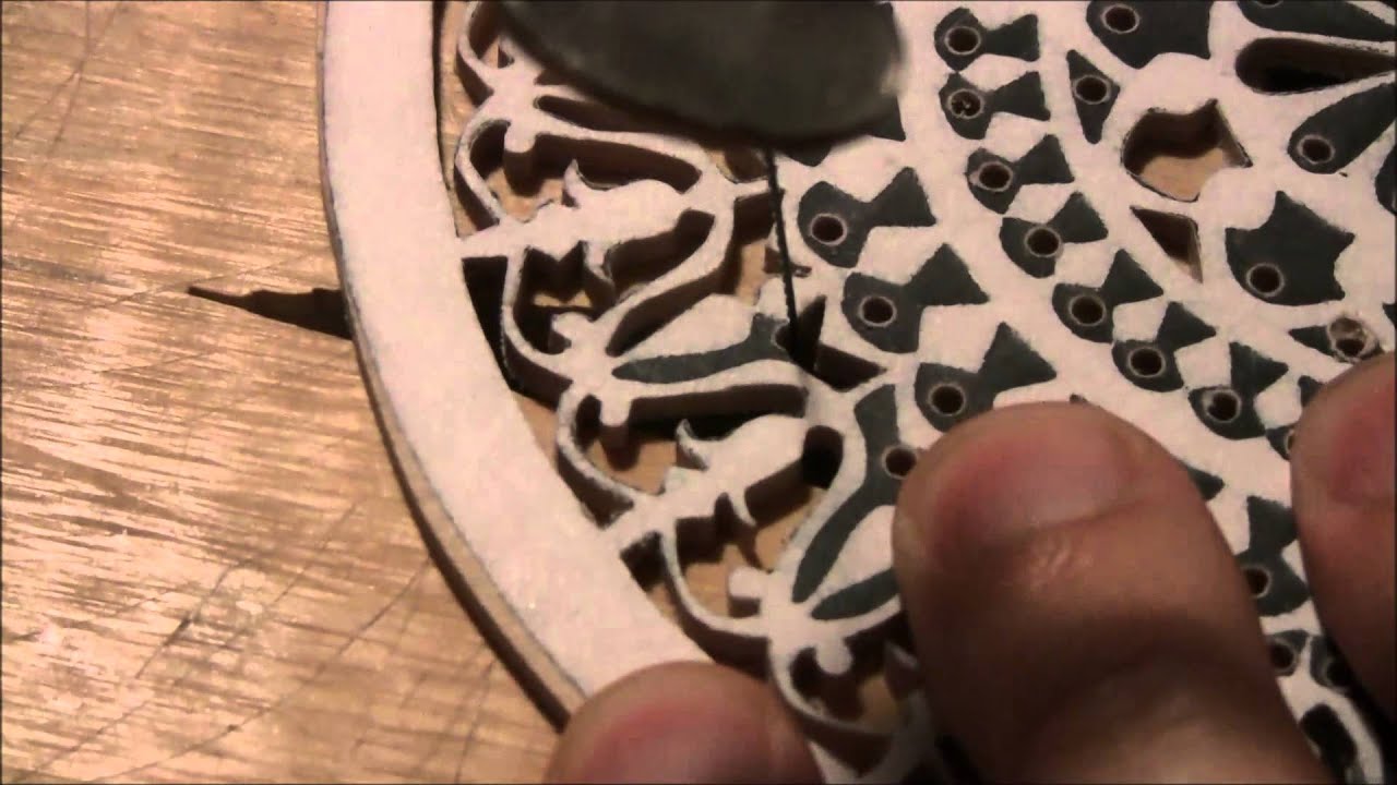 Cutting an oud rosette by hand