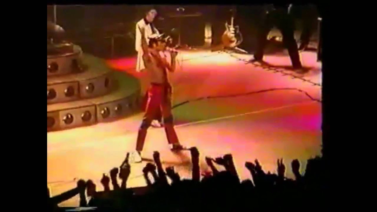Queen-We Will Rock You-We Are The Champions Live Hammersmith 79