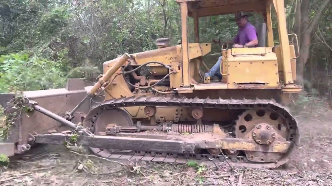 Cat D4E Pushing and Clearing Land