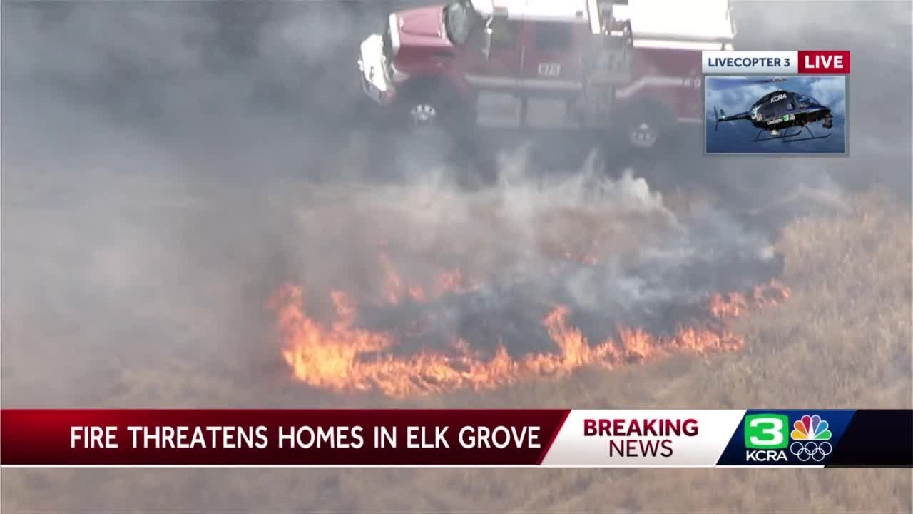 Structures threatened as crews battle grass fire in Sacramento County