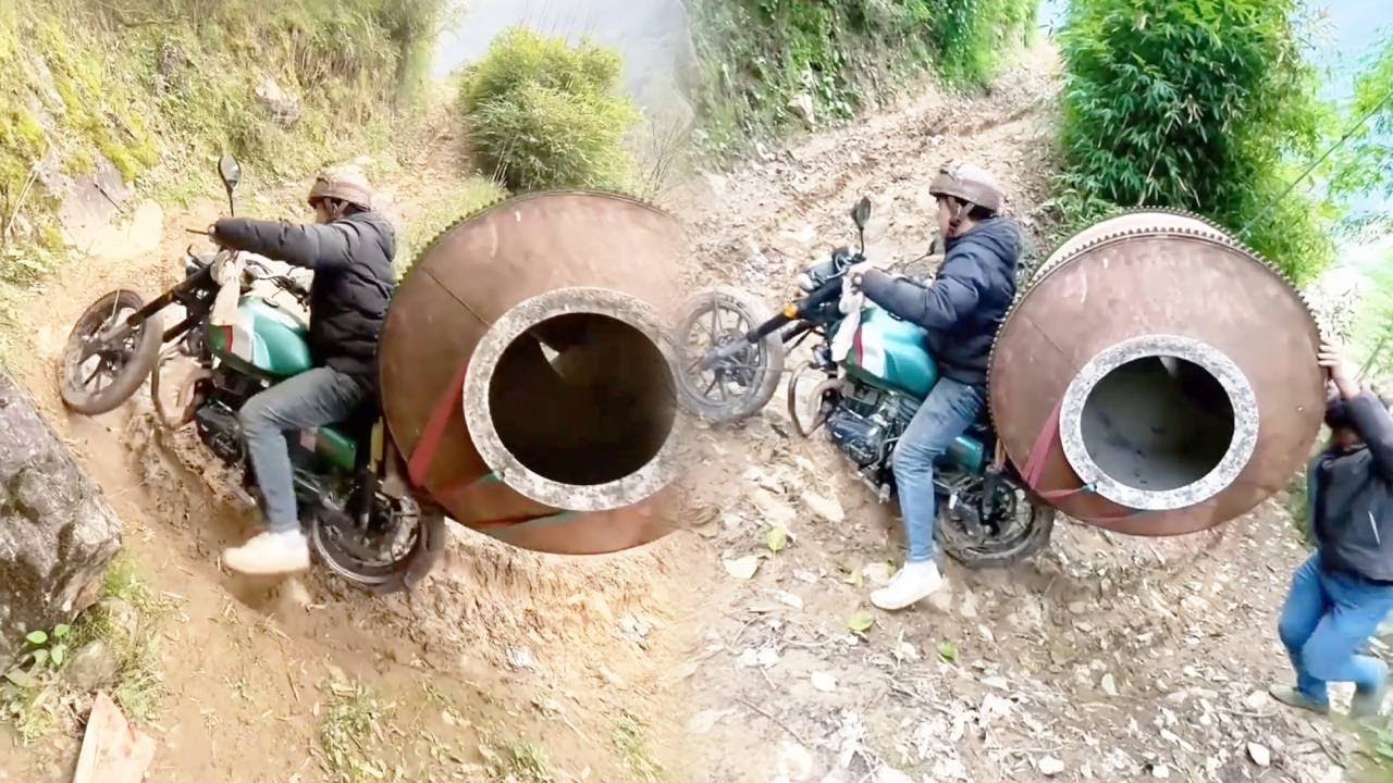 Водитель мотоцикла вез гигантский шар по извилистой и опасной горной дороге.