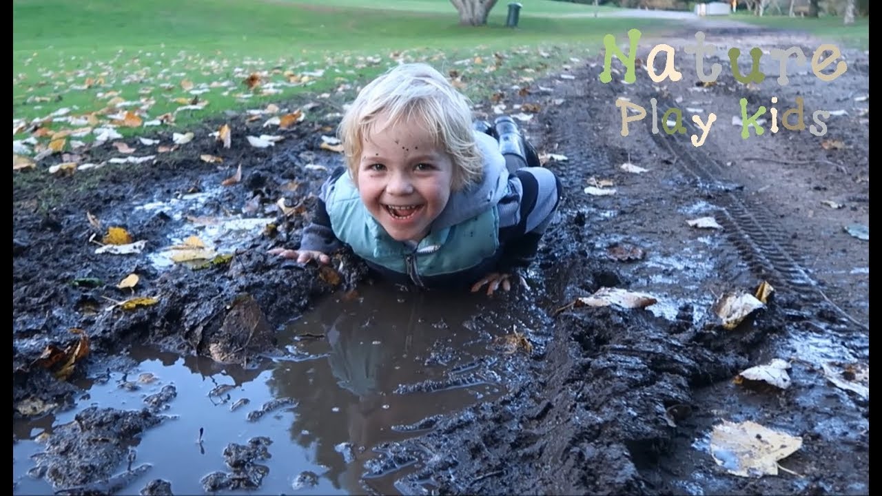 The kids fall and lie down in muddy puddles. CRAZY!