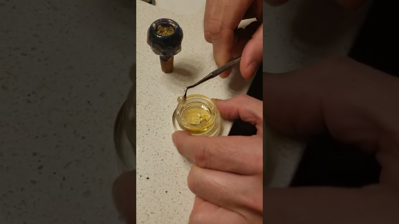 Topping a bong with D8 distillate.