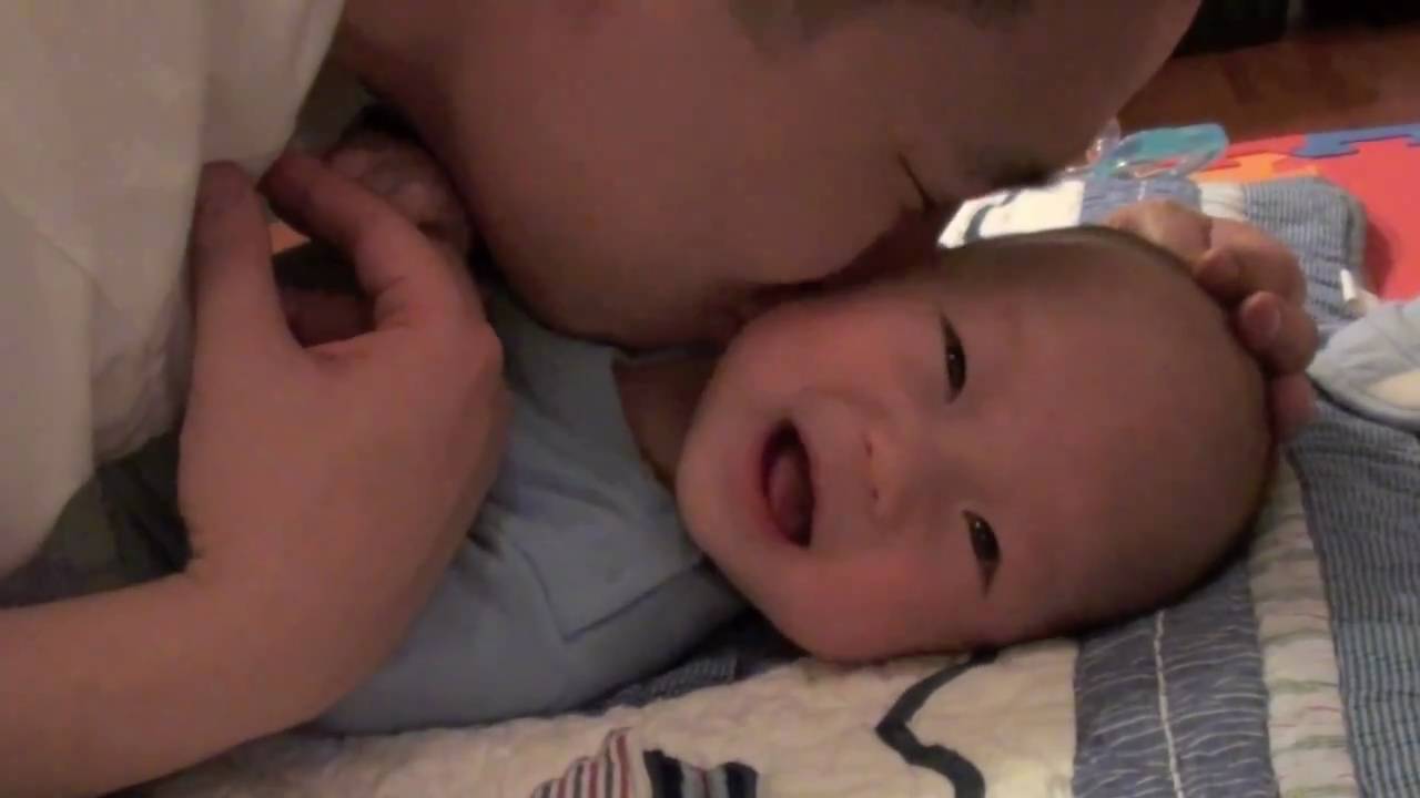 Daddy tickling Baby