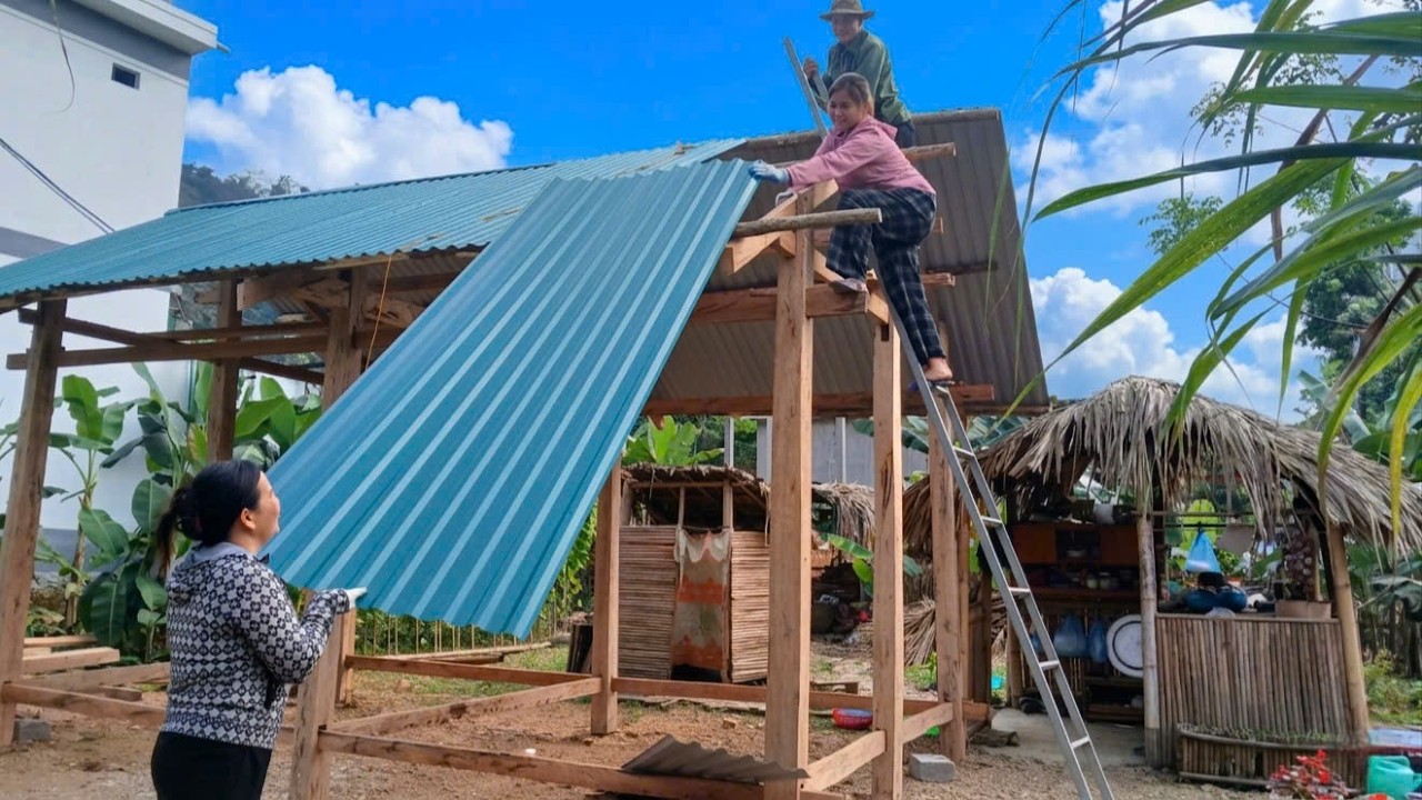 PHAN, HA, and KONG enthusiastically came to help DAN install the corrugated iron roof on new house.
