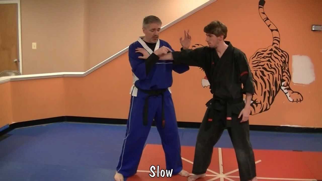 Glancing Salute - Kenpo self defense technique for a right cross push and you break the arm