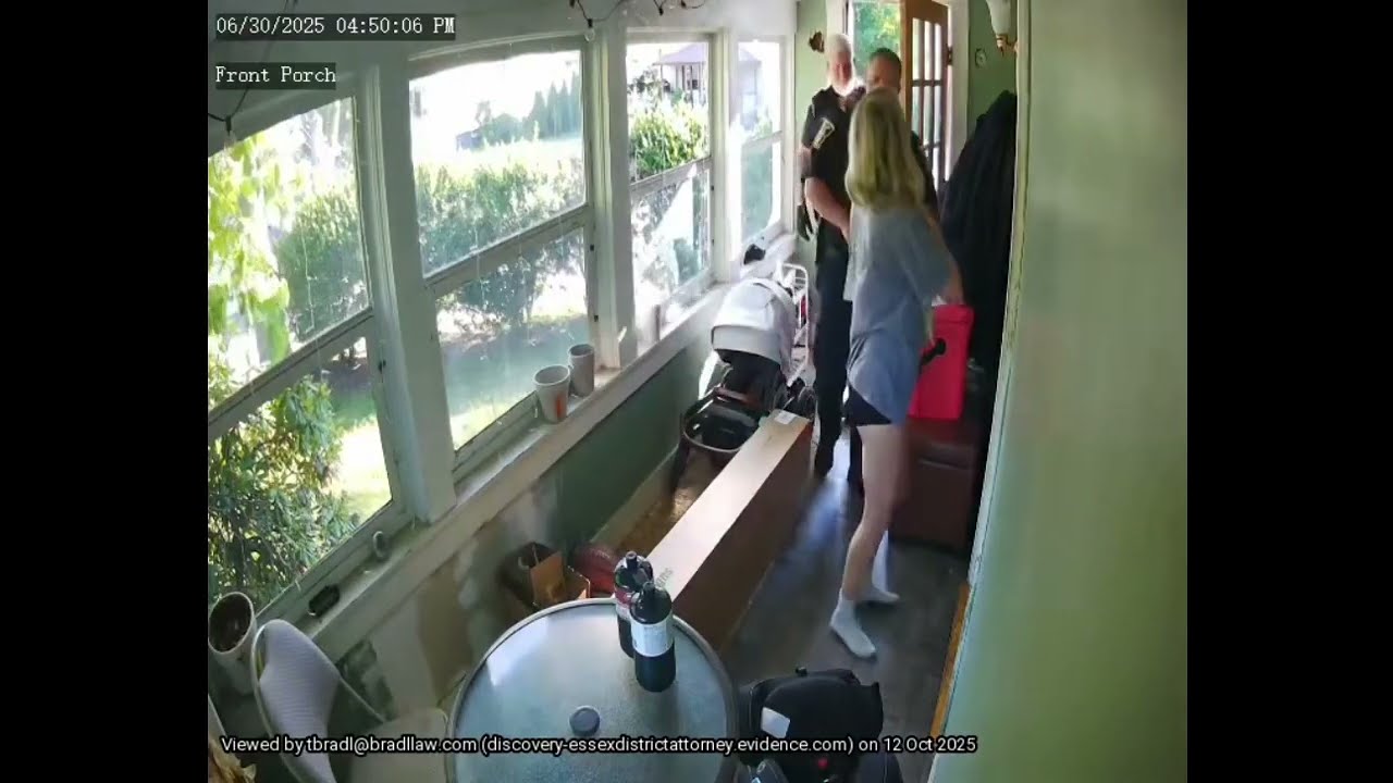North Andover Police officers with Kelsey answering the door with her four month old son in her arms