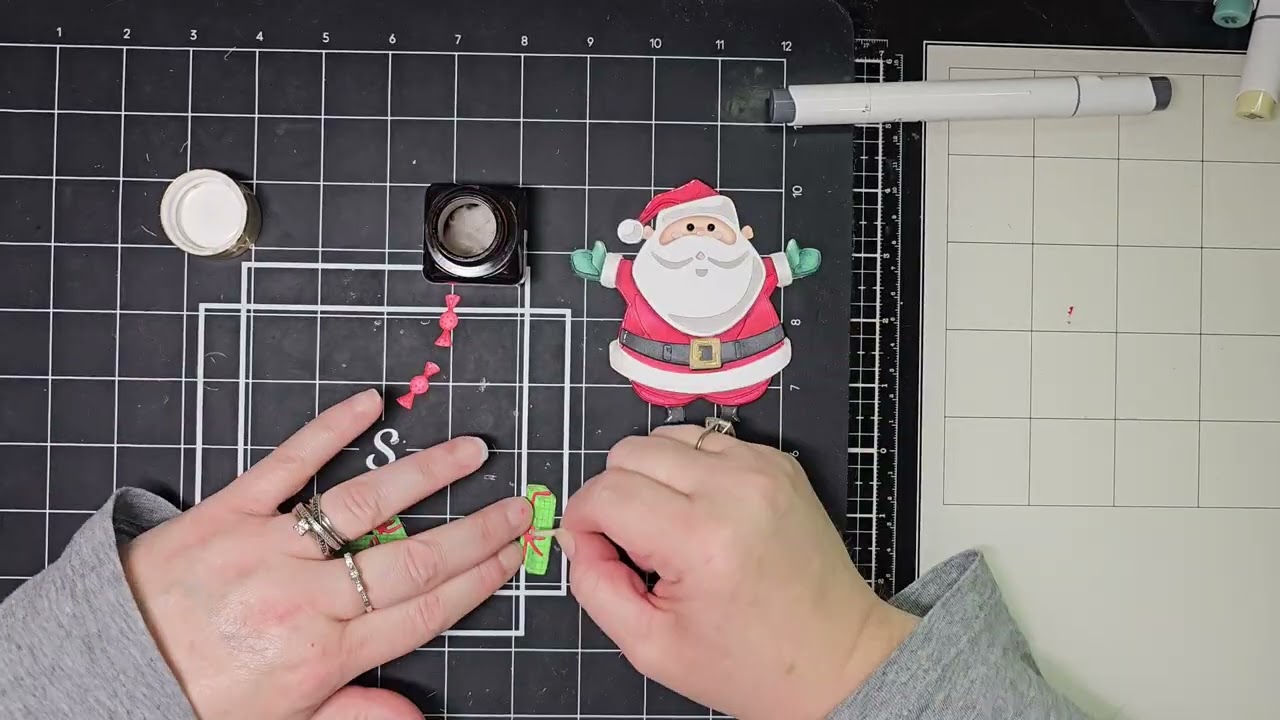 Creating a fun juggling Santa card that uses Tim Holtz Santa Greetings die set.