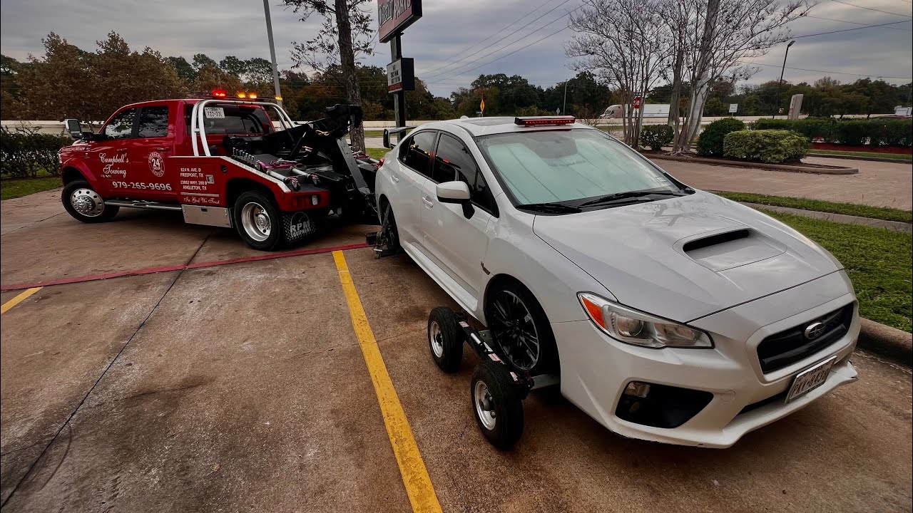 Towing an ABANDONED Subaru WRX!